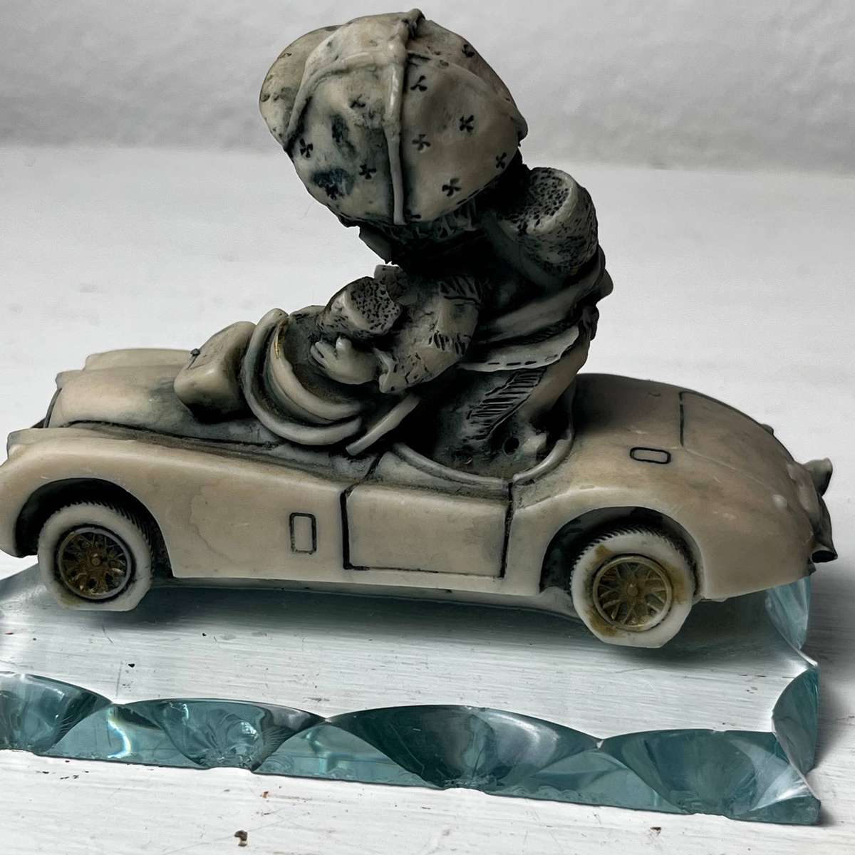 Vintage Boy in Car Figurine on Glass Base 10cm
