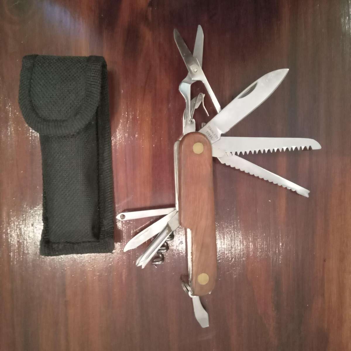 Multi tool knife with wooden inlay