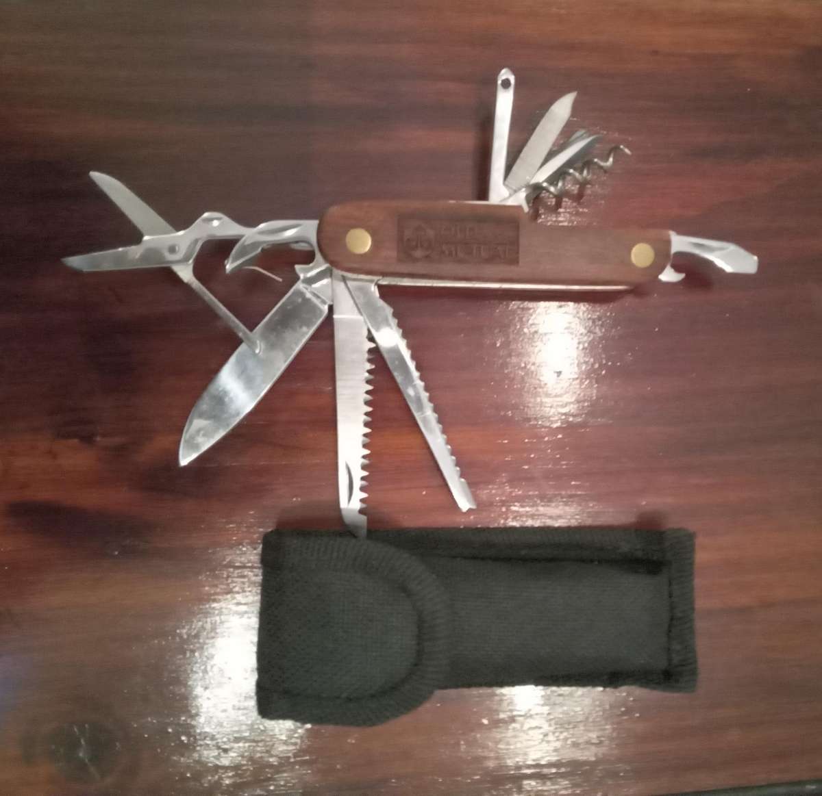 Multi tool knife with wooden inlay