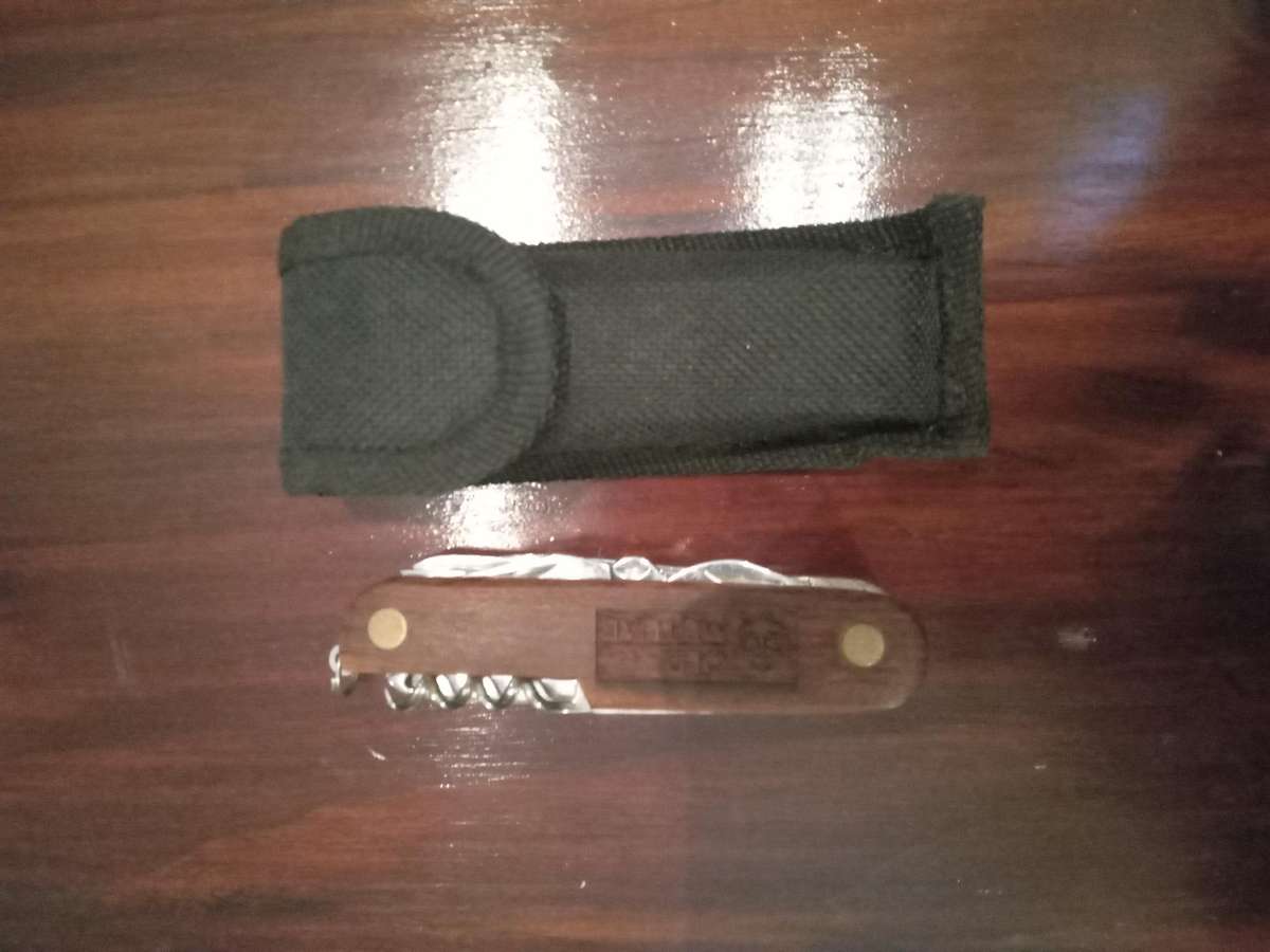 Multi tool knife with wooden inlay