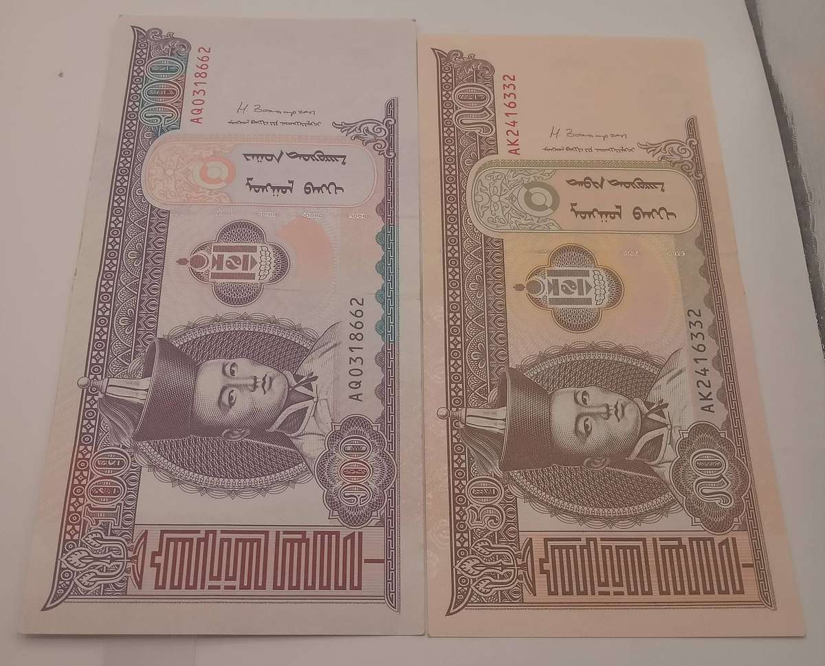 TWO MONGOLIAN BANK NOTES: 1 X 50 TUGRIK AND 1 X 100 TUGRIK -UNC CONDITION