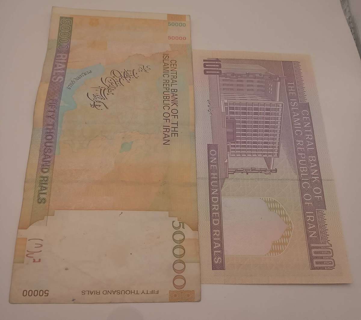 TWO IRAN RIALS BANK NOTES- 1 X 100 RIALS AND 1 X 50000 RIALS