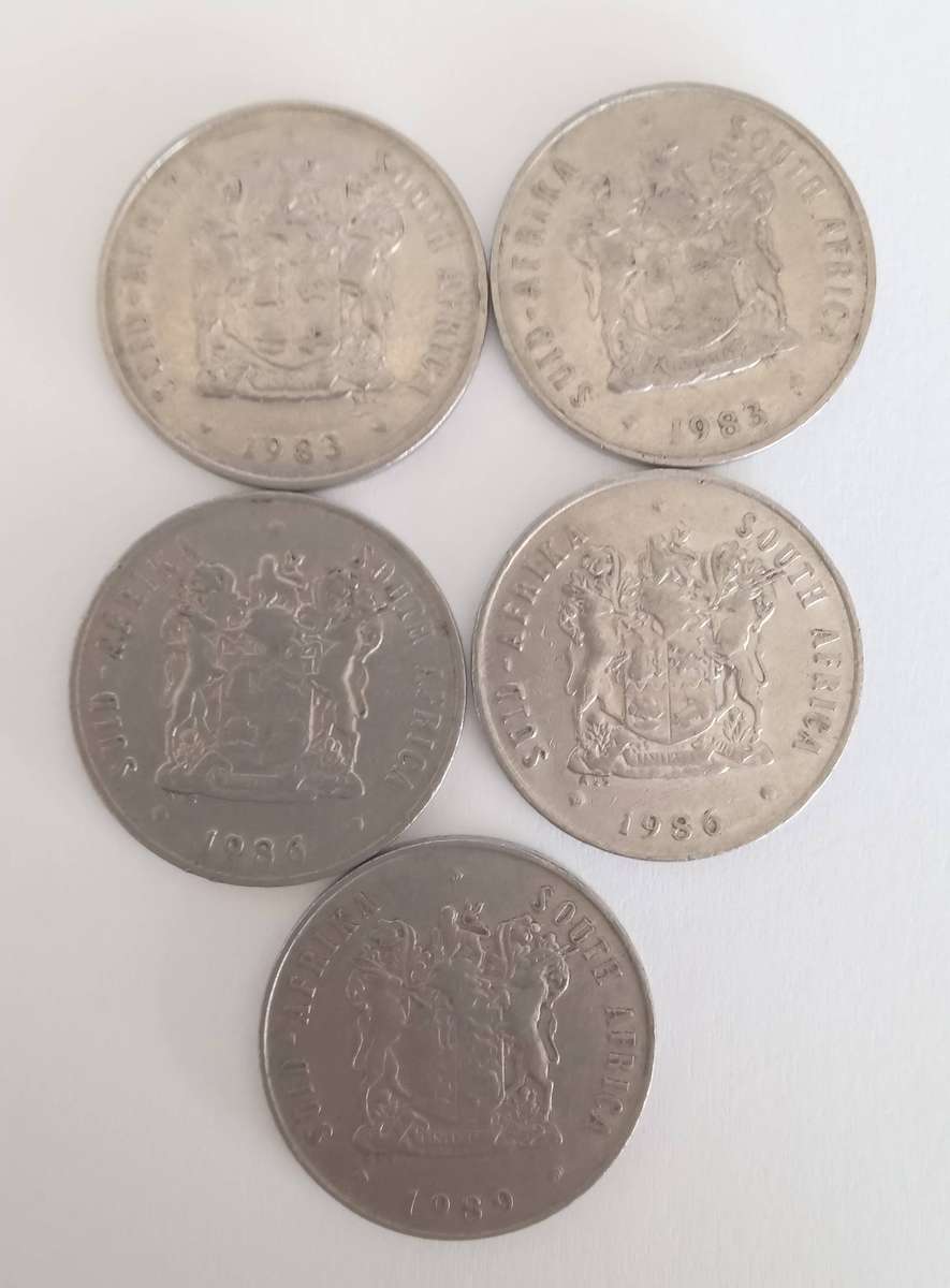 FIVE SA TWENTY CENT COINS: 2 X 1983, 2 X 1986 AND 1 X 1989