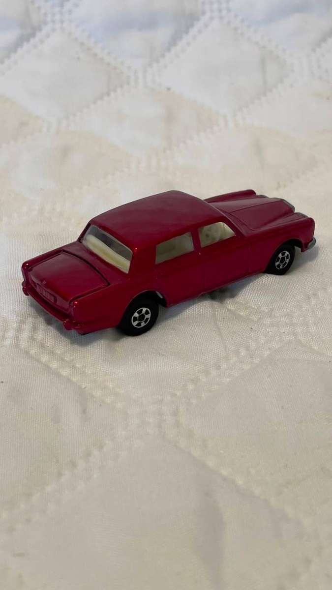Vintage 1960s Matchbox Lesney Rolls-Royce Silver Shadow in red.
