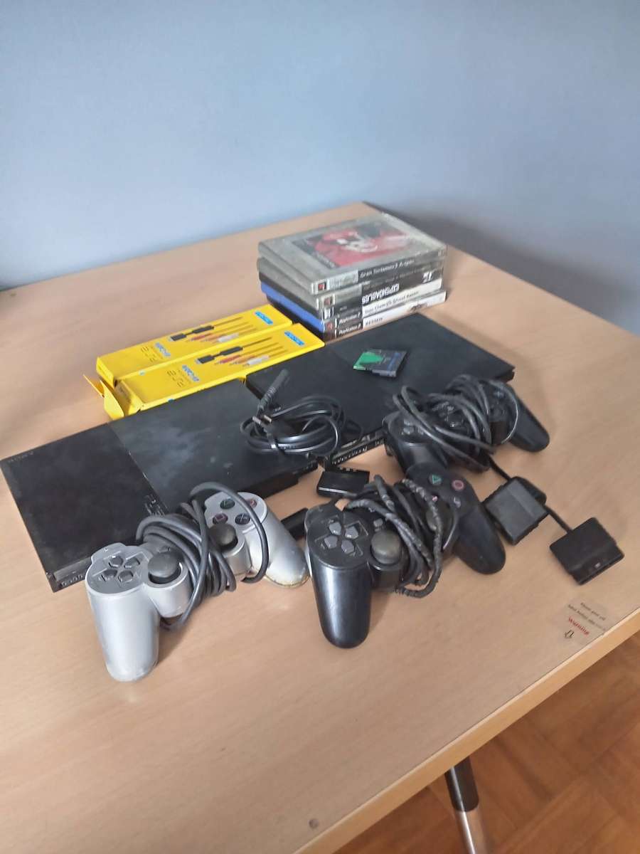 2 x Playstation 2 Consoles with 3 Controllers  and Games