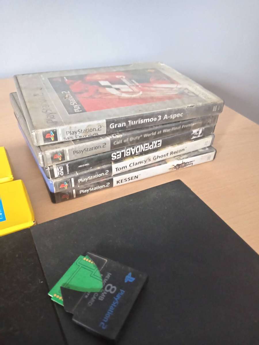 2 x Playstation 2 Consoles with 3 Controllers  and Games