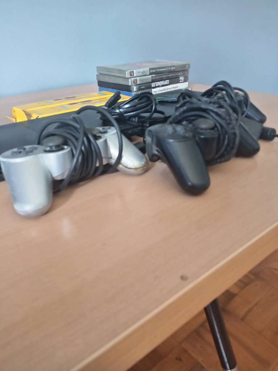 2 x Playstation 2 Consoles with 3 Controllers  and Games