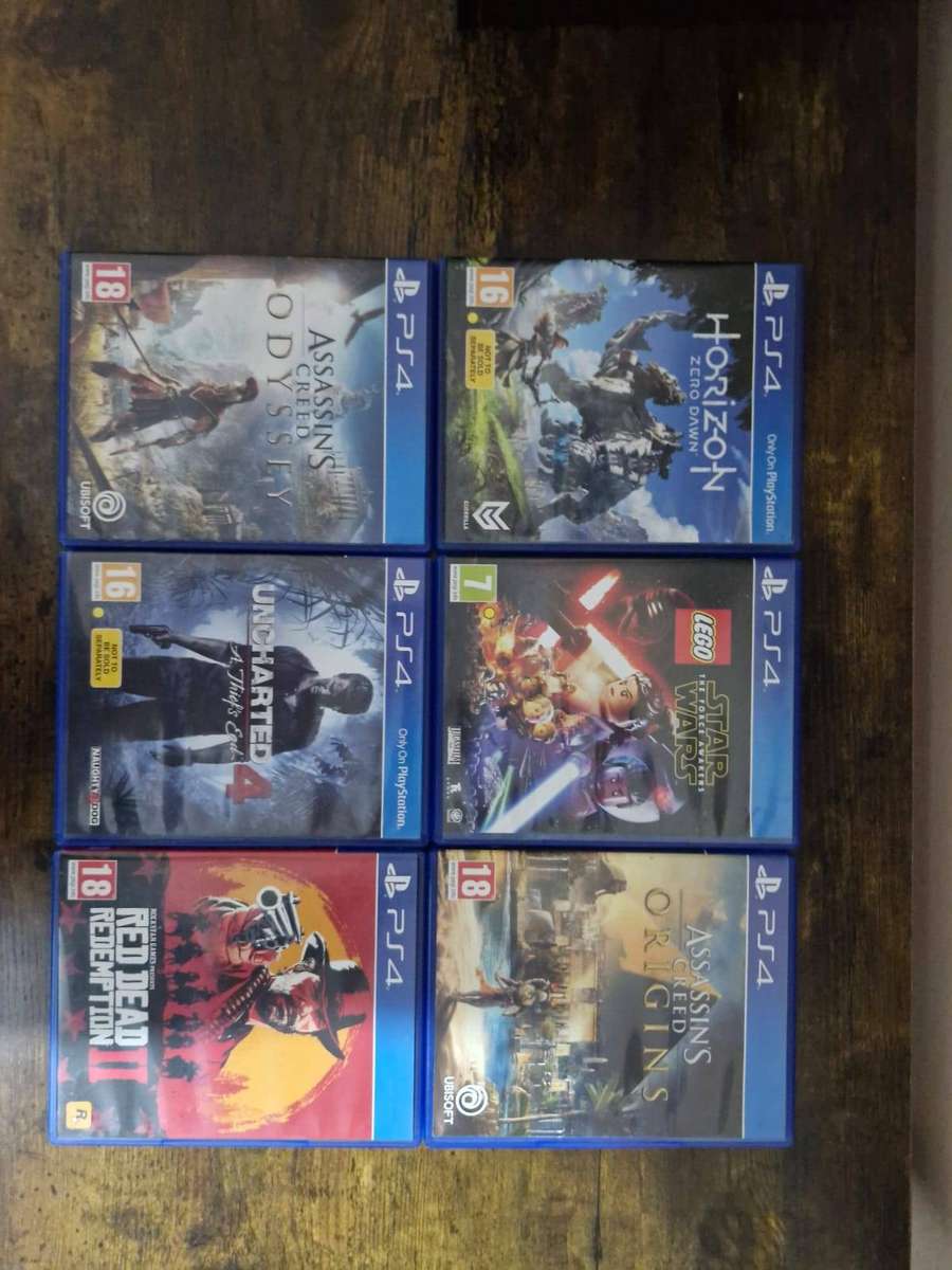 PlayStation 5 1TB + 2 DualSense Controllers + 4 PS5 Games and 15 PS 4 Games