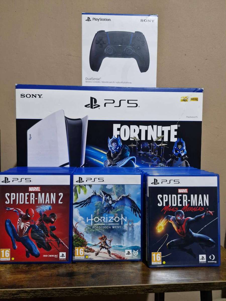 PlayStation 5 1TB + 2 DualSense Controllers + 4 PS5 Games and 15 PS 4 Games