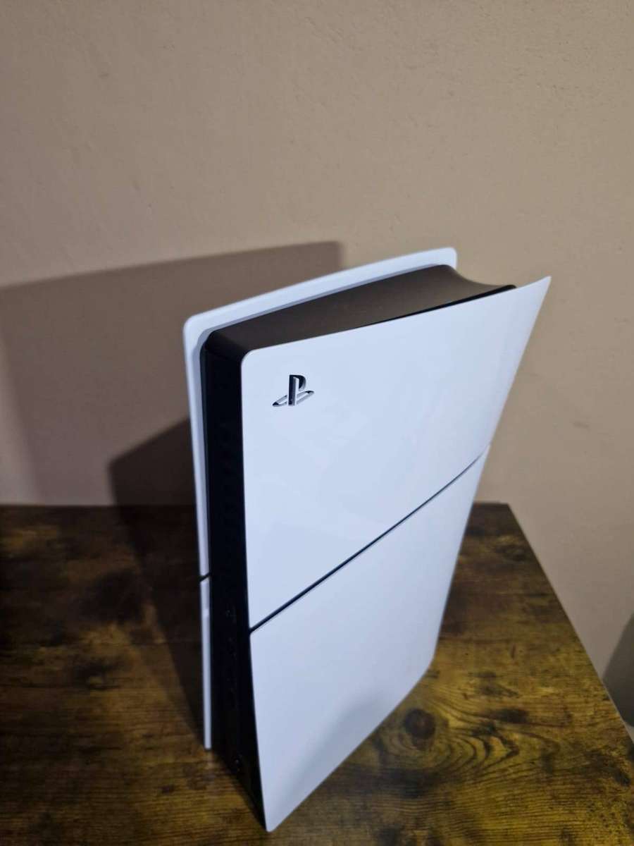 PlayStation 5 1TB + 2 DualSense Controllers + 4 PS5 Games and 15 PS 4 Games