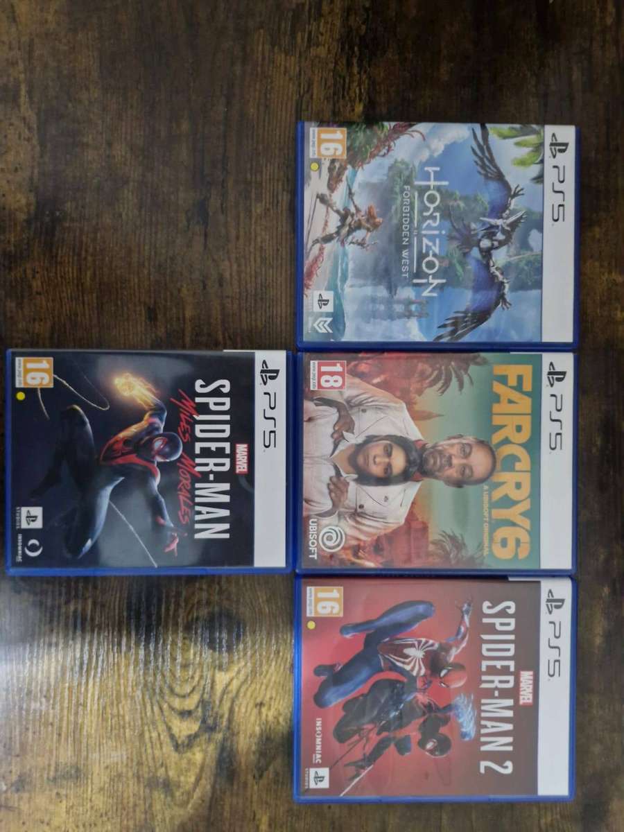 PlayStation 5 1TB + 2 DualSense Controllers + 4 PS5 Games and 15 PS 4 Games