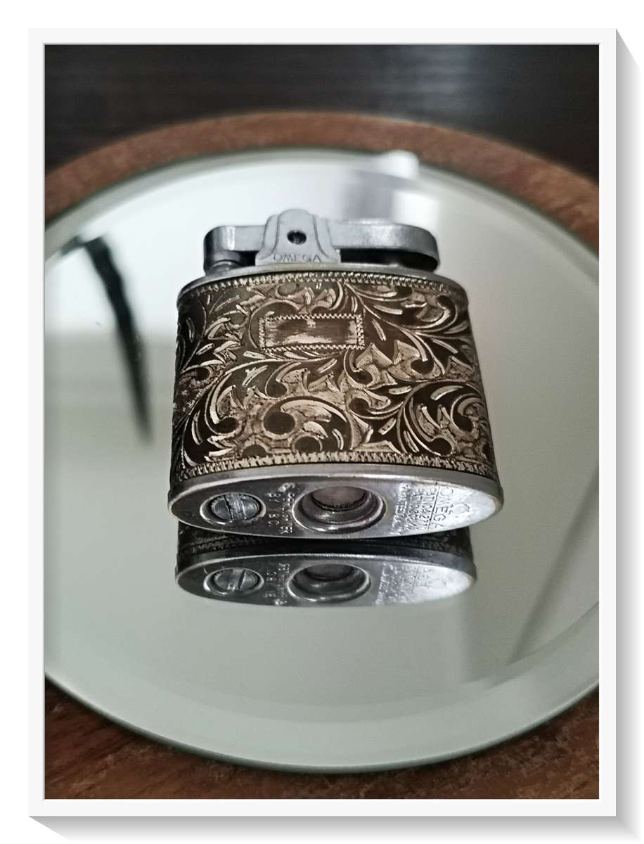 Vintage Paisley Silver and Gold Omega Lighter in Good Condition