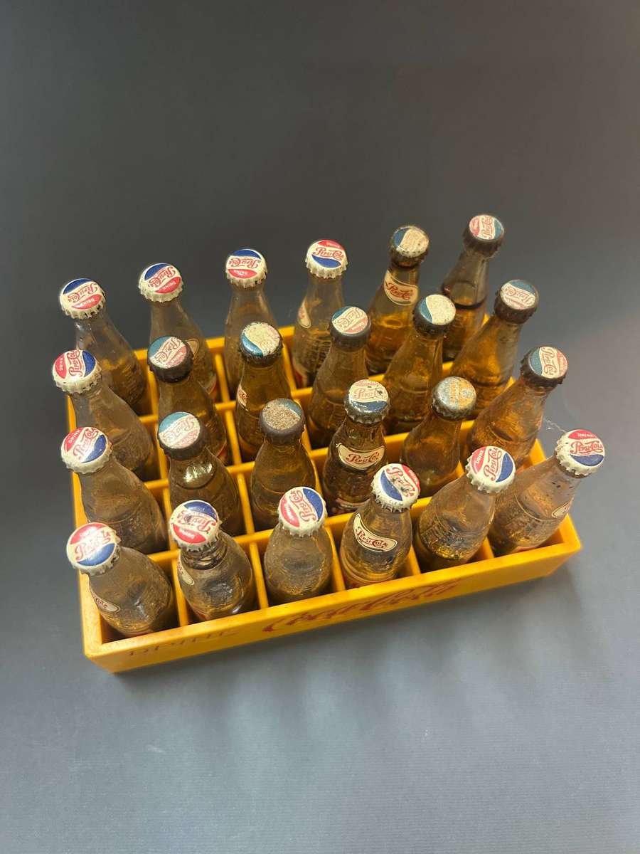 Coca Cola crate with Pepsi bottles
