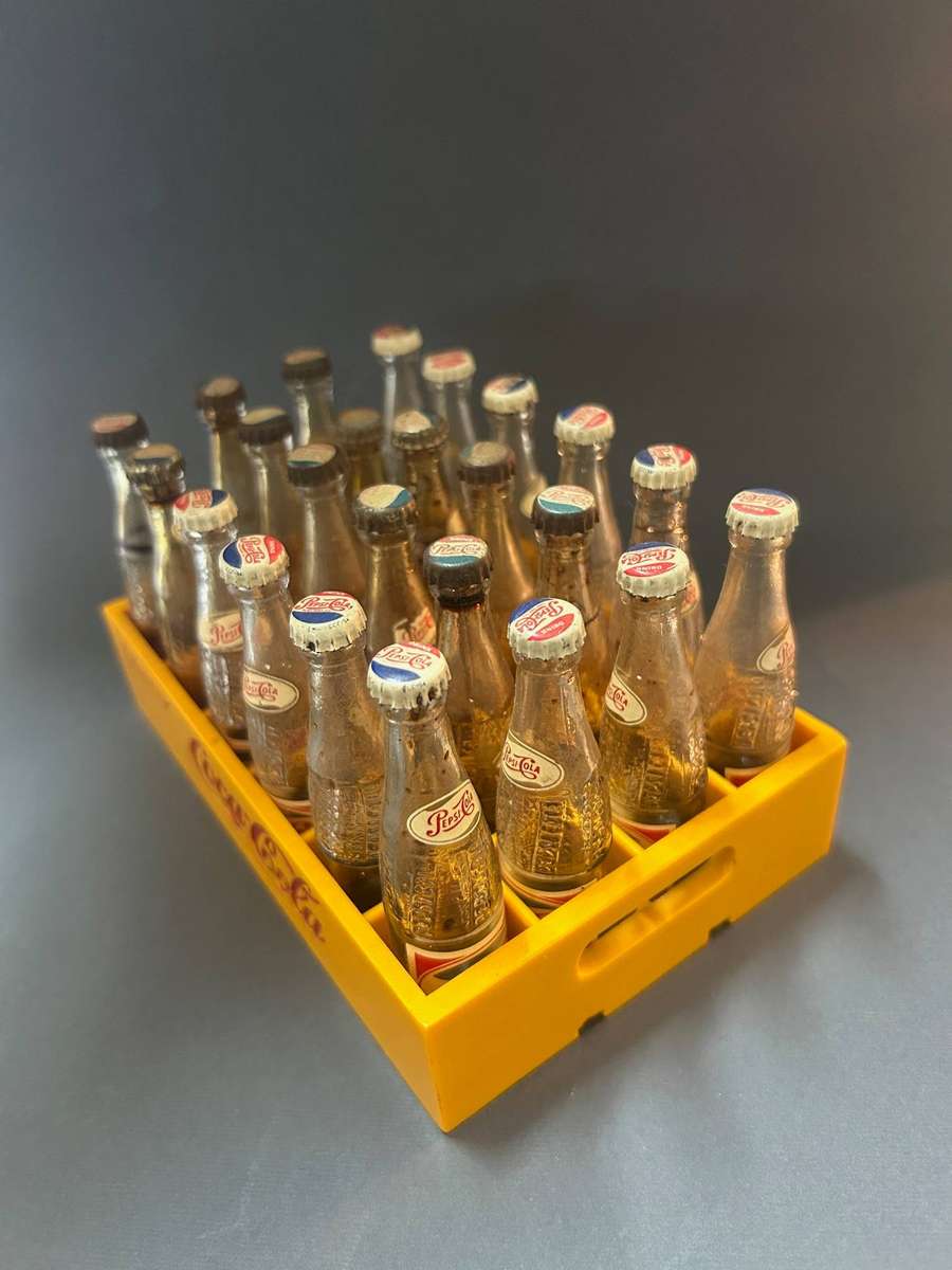 Coca Cola crate with Pepsi bottles