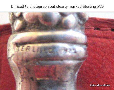 A fairly large sterling silver letter opener in a leather cover-- Sterling silver handle