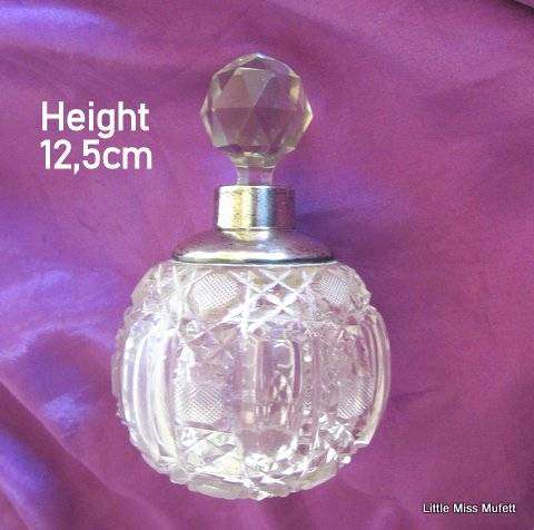 A Crystal perfume bottle with a hallmarked silver top--Read description