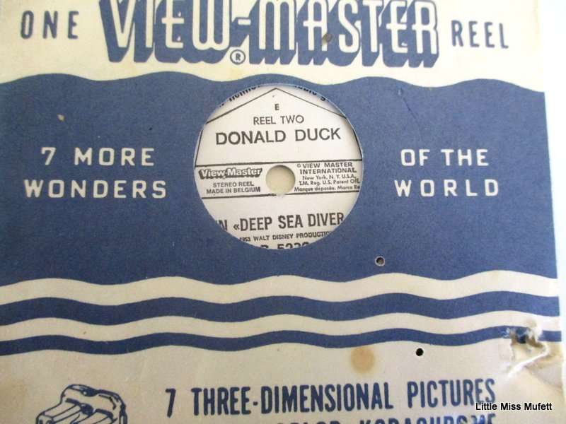 A Viewmaster with 11 reels including 3 Disney reels. Mickey Mouse,Donald Duck and Peter Pam