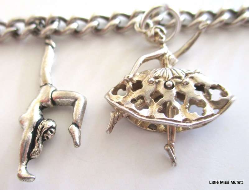 A Sterling silver charm bracelet with some interesting charms and a St. Christopher--21 Gram plus