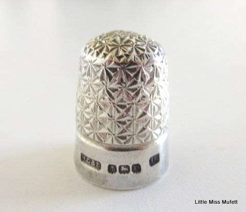A Hallmarked silver sugar snipper and a Hallmarked silver thimble--Total weight 25 gram