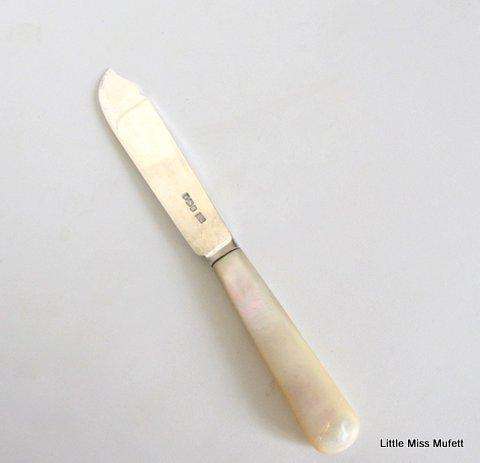 A Hallmarked silver  knife 1923 with a mother of pearl handle---R.F. Mosley and company
