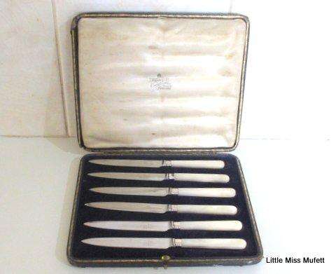 A Set of Fruit knives with hallmarked silver collars and mother of pearl handles--Boxed