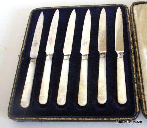 A Set of Fruit knives with hallmarked silver collars and mother of pearl handles--Boxed