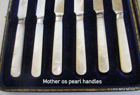 A Set of Fruit knives with hallmarked silver collars and mother of pearl handles--Boxed
