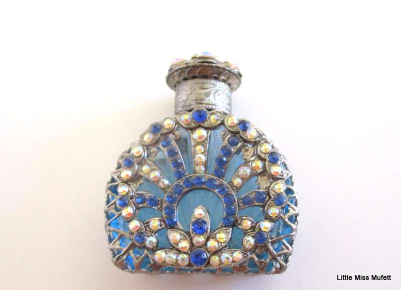 A czechoslovakia  glass perfume bottle with silver tone overlay--Perfect