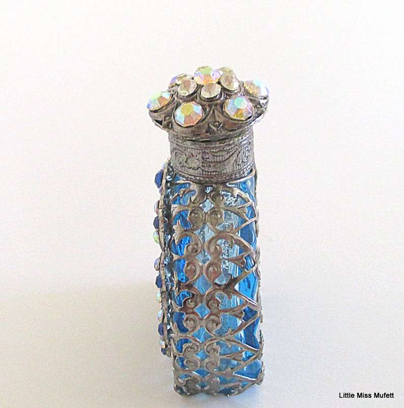 A czechoslovakia  glass perfume bottle with silver tone overlay--Perfect