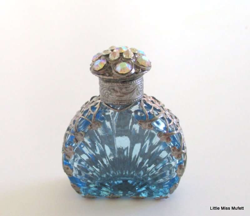 A czechoslovakia  glass perfume bottle with silver tone overlay--Perfect