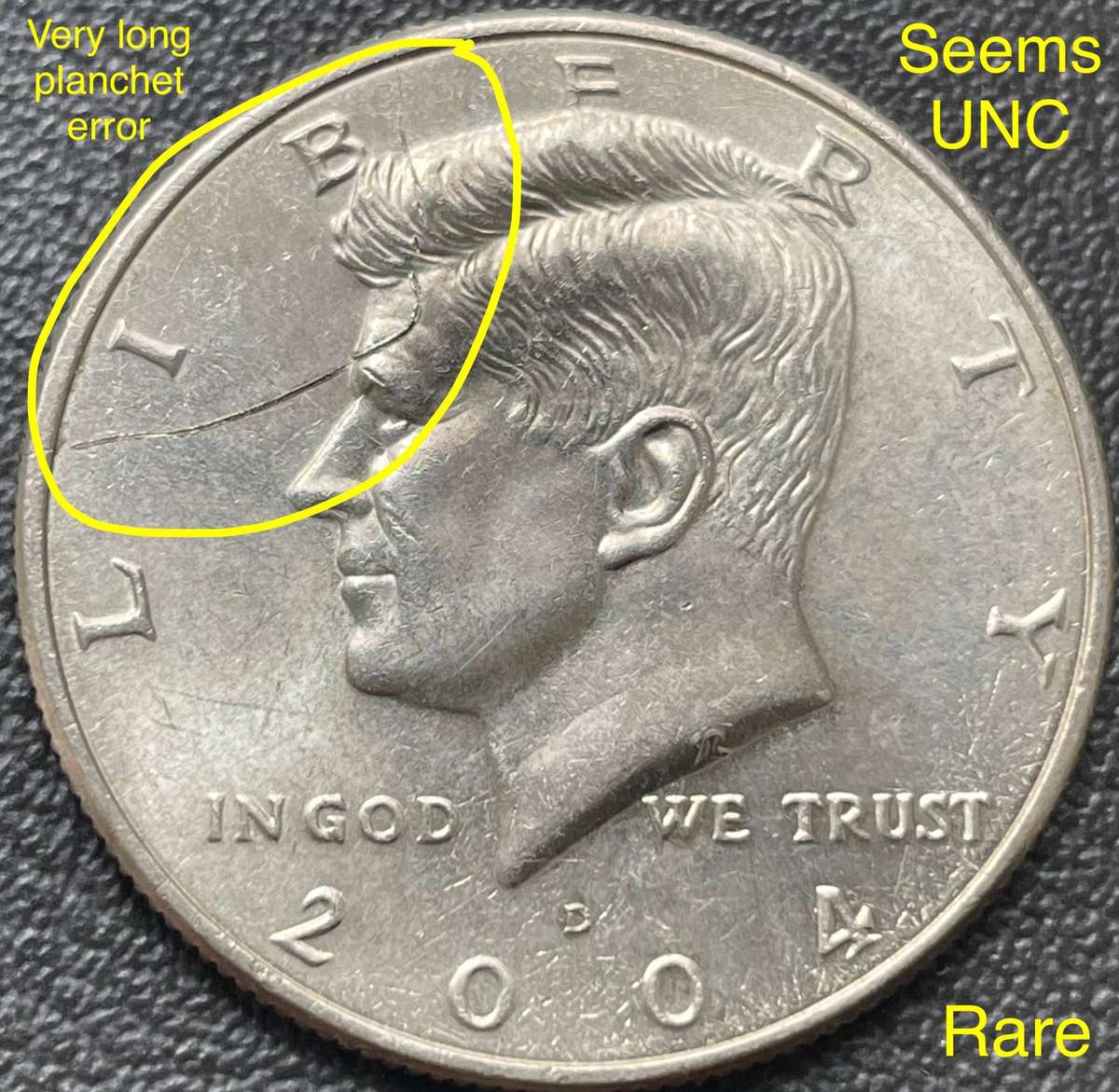 Rare error 2004 USA half dollar. Has a very long planchet flaw. Coin could be in UNC
