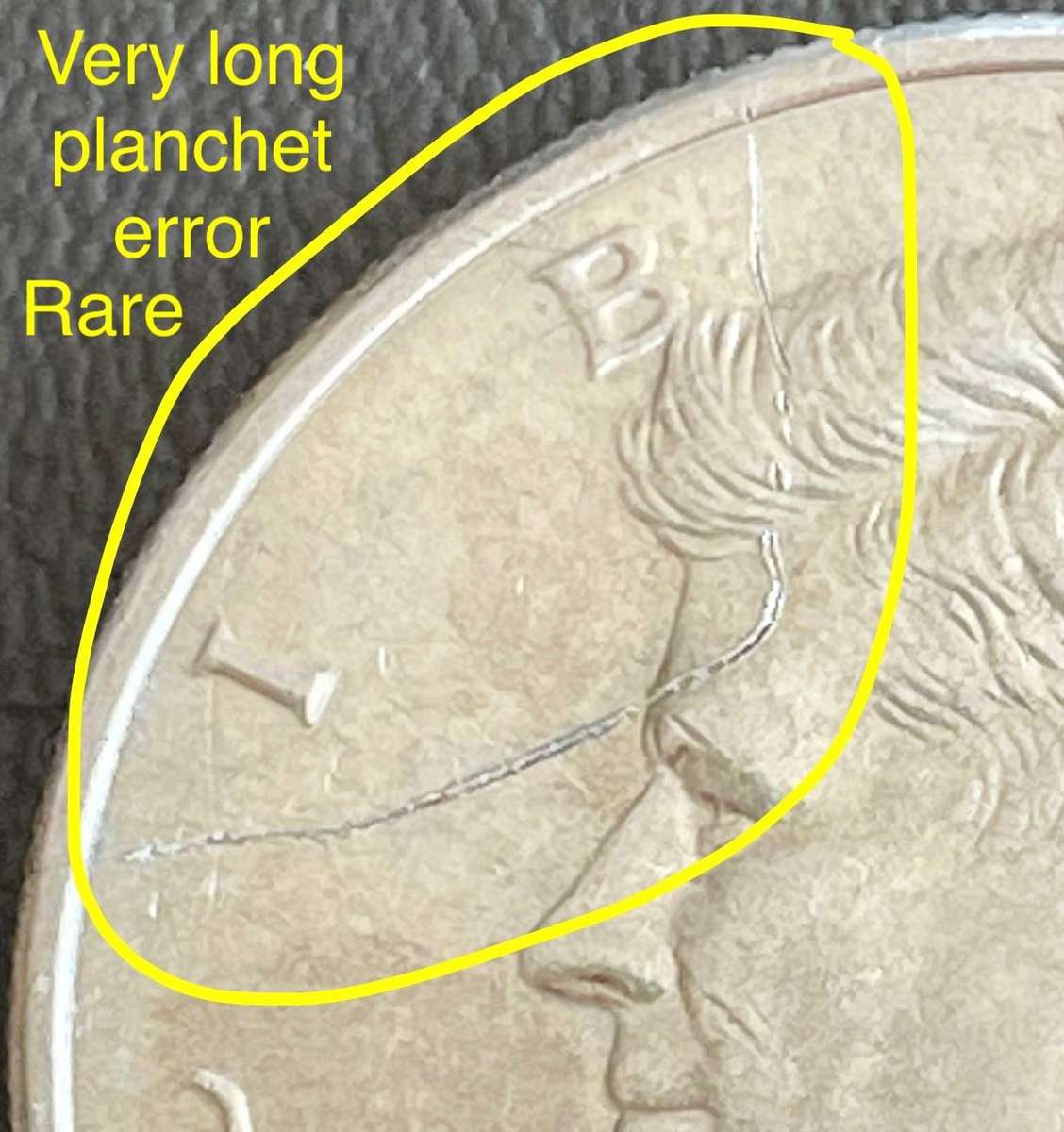 Rare error 2004 USA half dollar. Has a very long planchet flaw. Coin could be in UNC