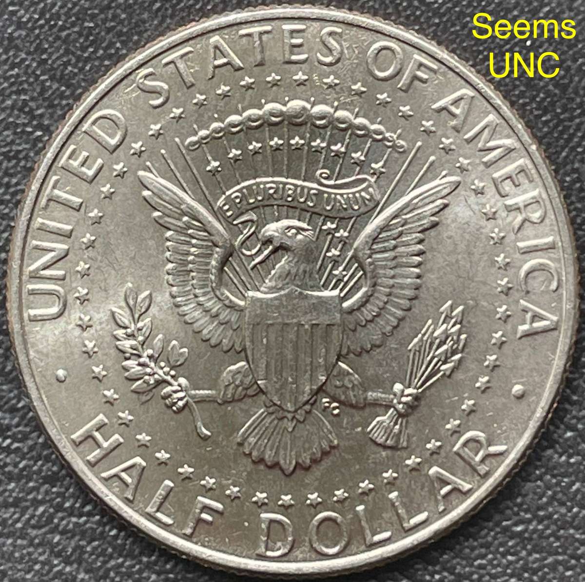 Rare error 2004 USA half dollar. Has a very long planchet flaw. Coin could be in UNC