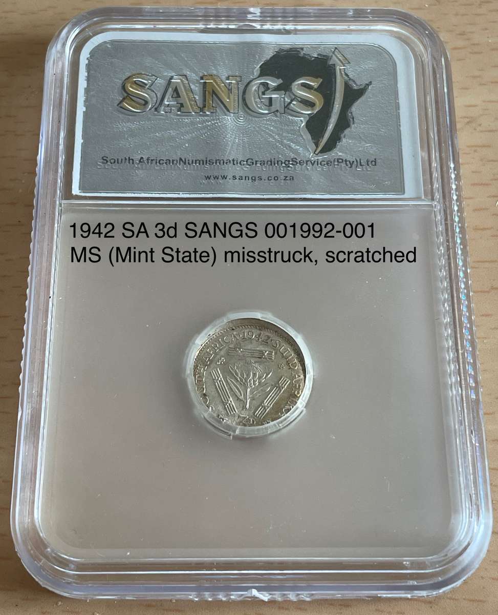Rare misstruck (extra rare broadstruck?) graded 1942 SA tickey 3d.