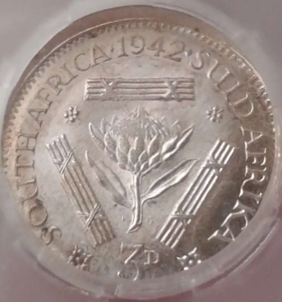 Rare misstruck (extra rare broadstruck?) graded 1942 SA tickey 3d.