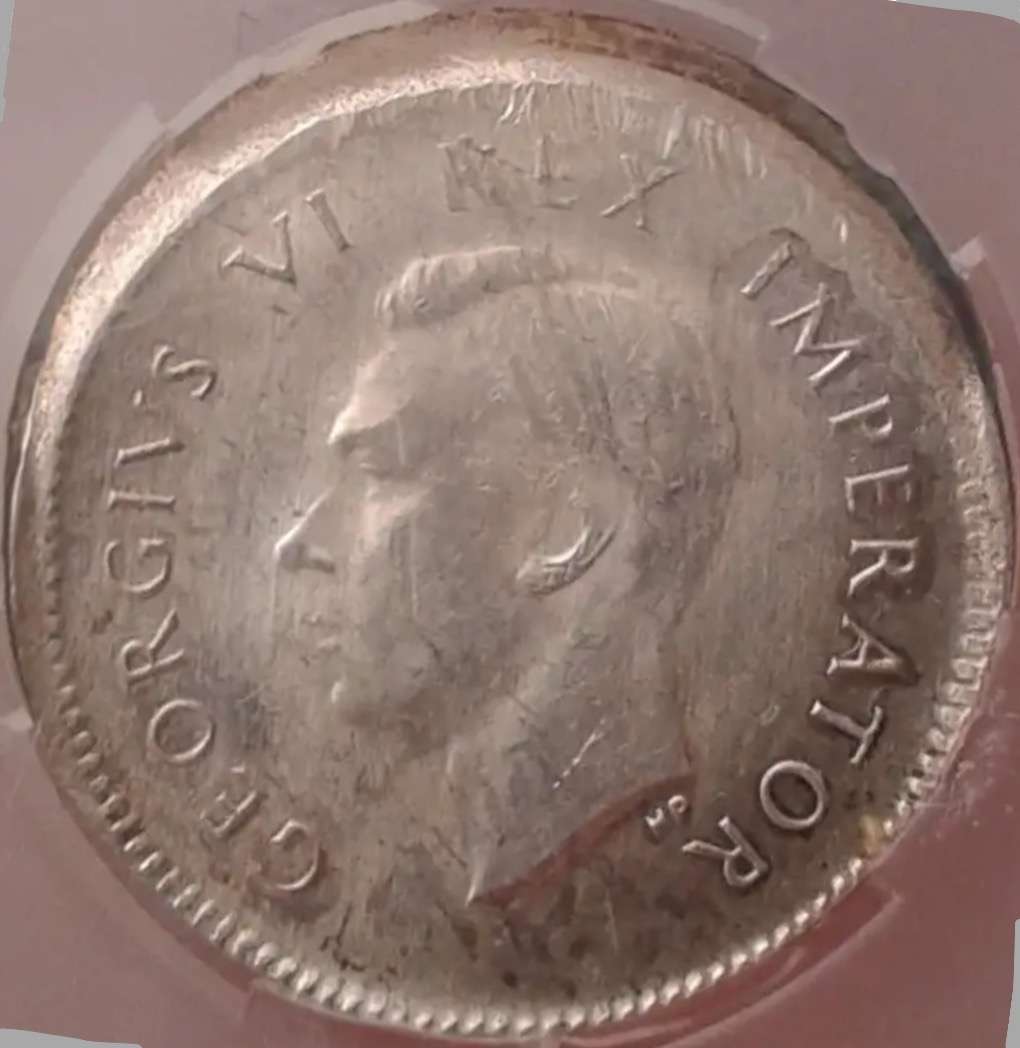 Rare misstruck (extra rare broadstruck?) graded 1942 SA tickey 3d.