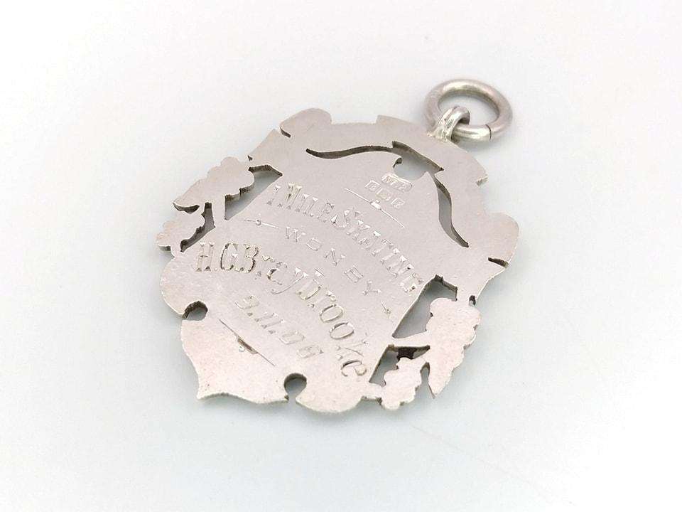 Sterling silver and yellow gold fob medal