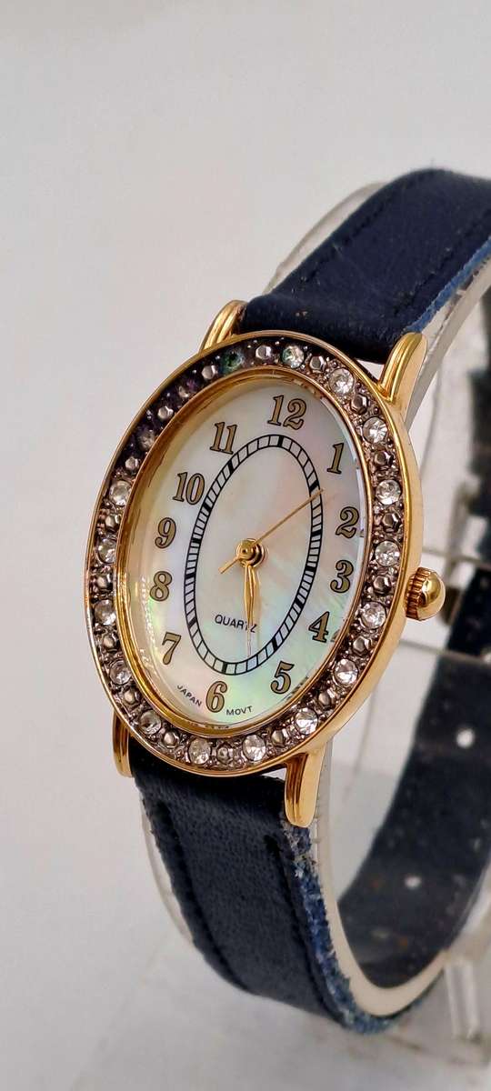 Pre-Owned Ladies AVON Quartz Watch -Working -missing a few decorative stones on the face