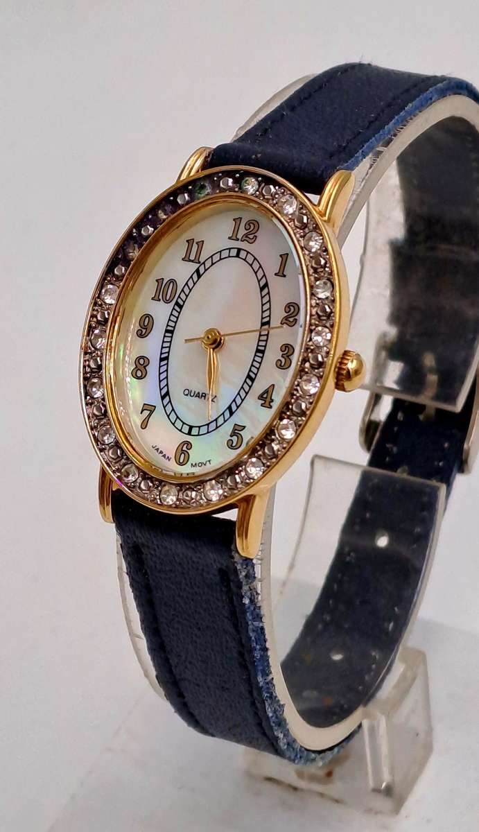 Pre-Owned Ladies AVON Quartz Watch -Working -missing a few decorative stones on the face