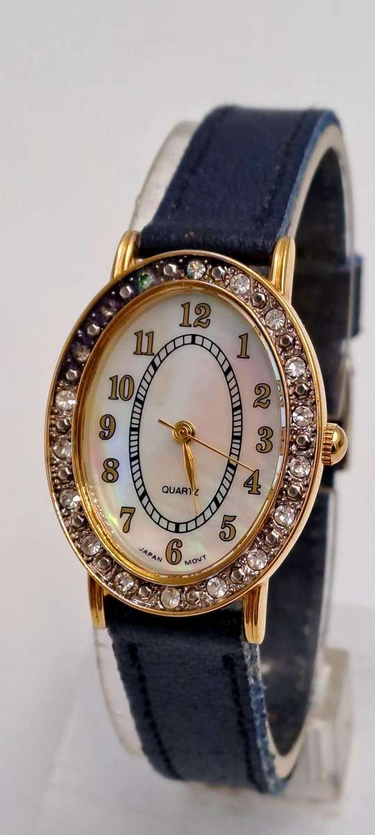 Pre-Owned Ladies AVON Quartz Watch -Working -missing a few decorative stones on the face