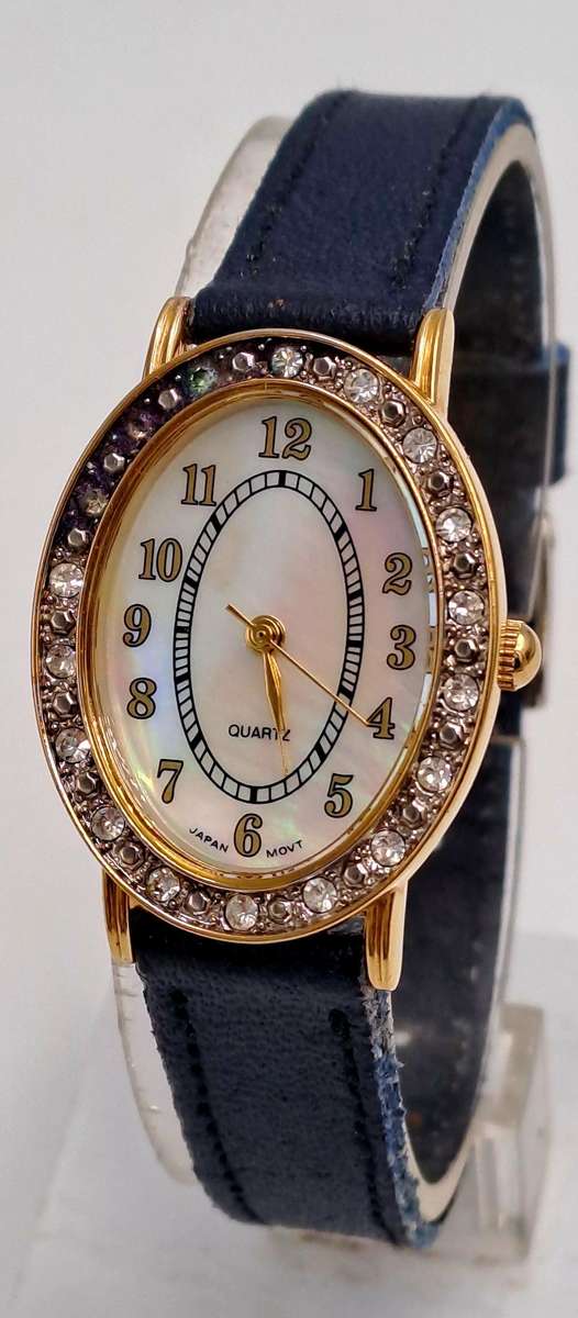 Pre-Owned Ladies AVON Quartz Watch -Working -missing a few decorative stones on the face