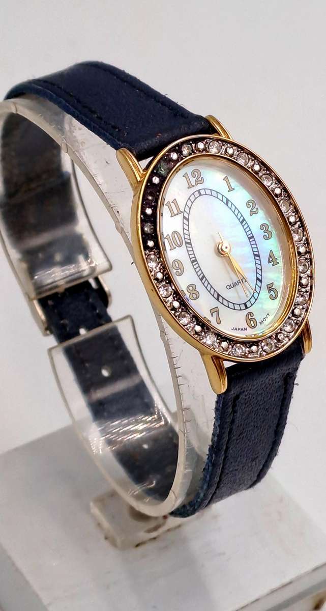 Pre-Owned Ladies AVON Quartz Watch -Working -missing a few decorative stones on the face