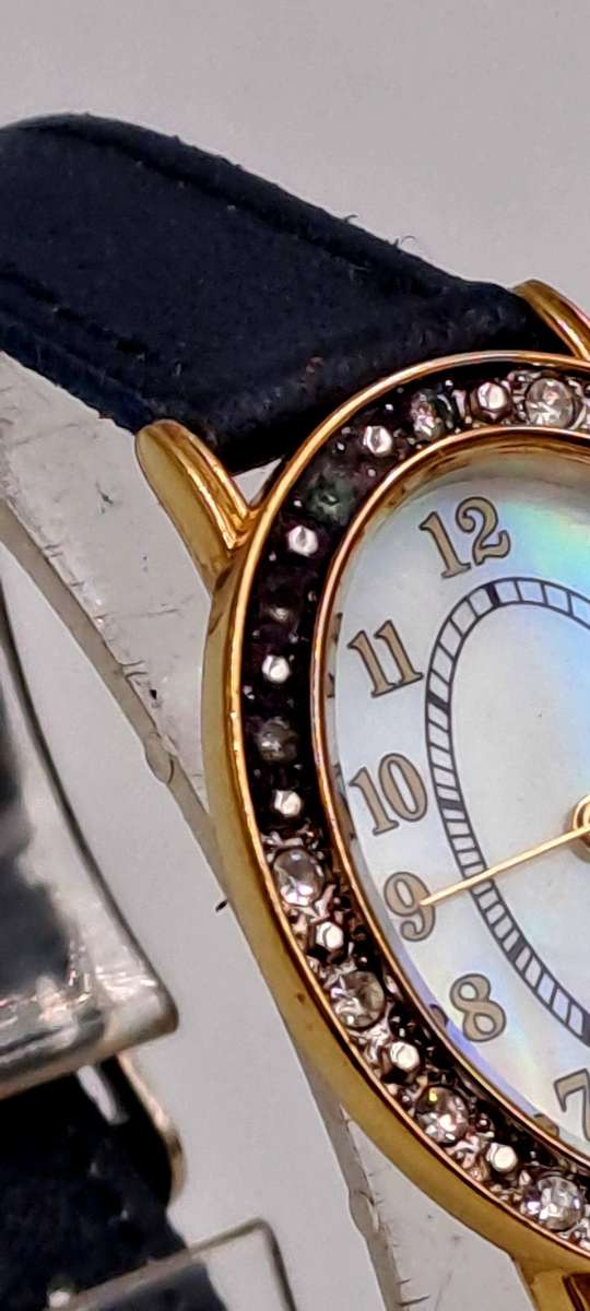 Pre-Owned Ladies AVON Quartz Watch -Working -missing a few decorative stones on the face