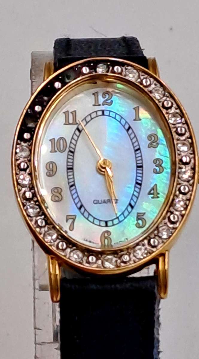 Pre-Owned Ladies AVON Quartz Watch -Working -missing a few decorative stones on the face