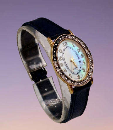 Pre-Owned Ladies AVON Quartz Watch -Working -missing a few decorative stones on the face