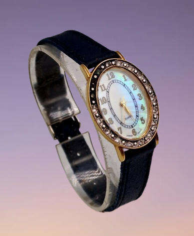 Pre-Owned Ladies AVON Quartz Watch -Working -missing a few decorative stones on the face