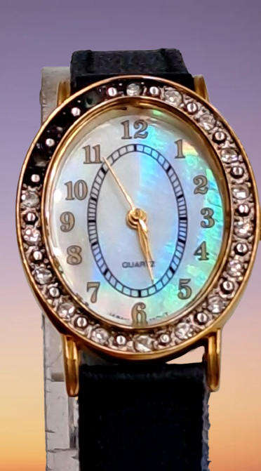 Pre-Owned Ladies AVON Quartz Watch -Working -missing a few decorative stones on the face