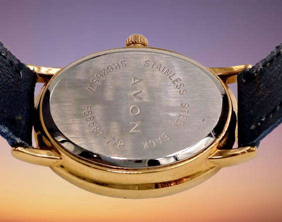 Pre-Owned Ladies AVON Quartz Watch -Working -missing a few decorative stones on the face