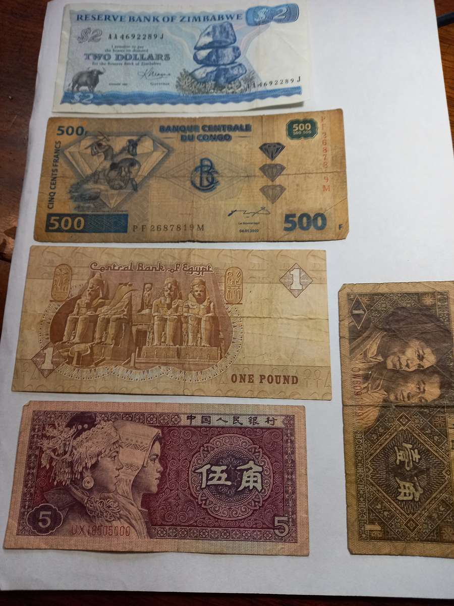 Various Bank Notes, Zimbabwe 2 $ in very good condition, interesting label stuck on back of note.