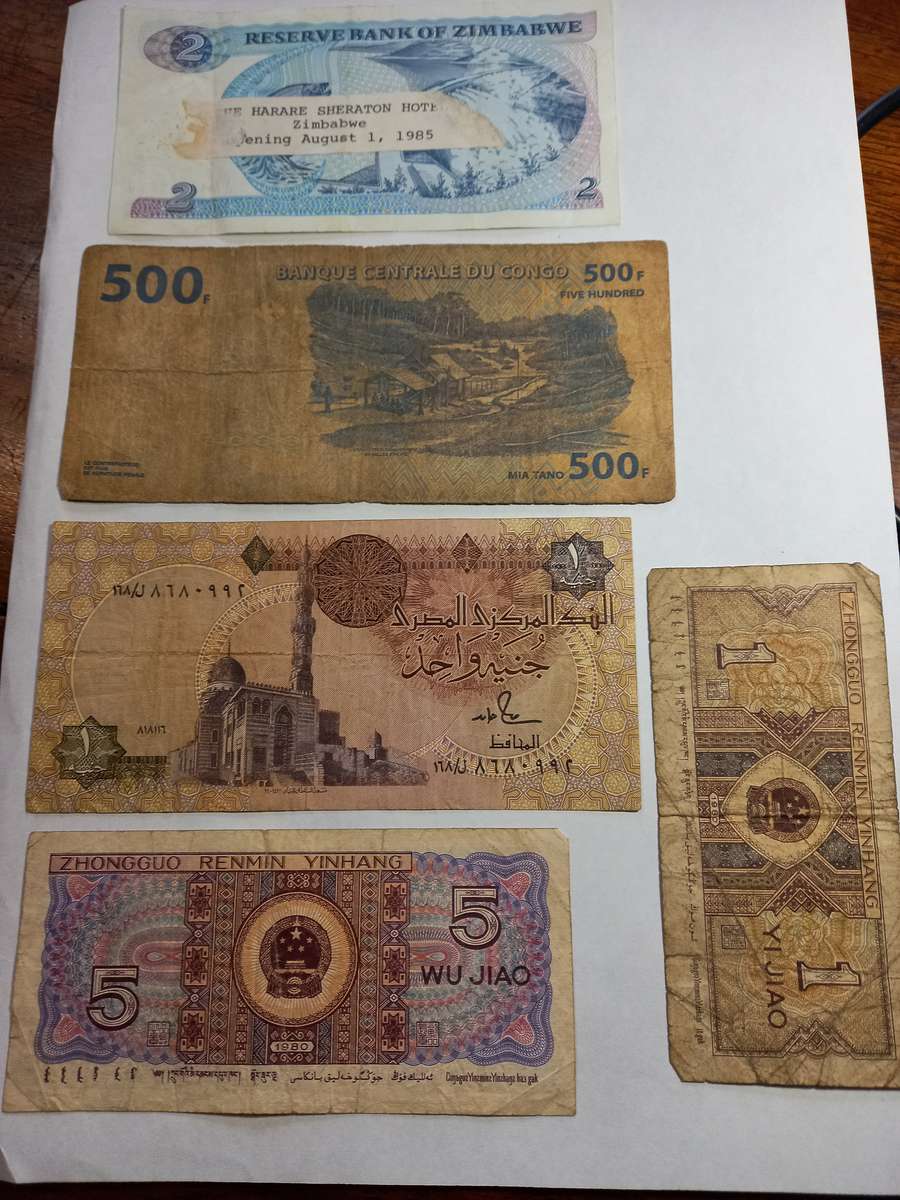 Various Bank Notes, Zimbabwe 2 $ in very good condition, interesting label stuck on back of note.